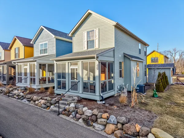 a front view of a house with garden