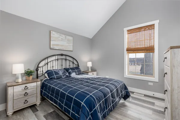 a bedroom with a bed and a window in it