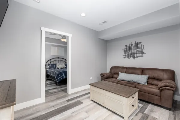 a view of a house with backyard and sitting area