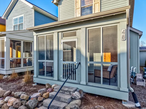 a view of a brick house with a large window