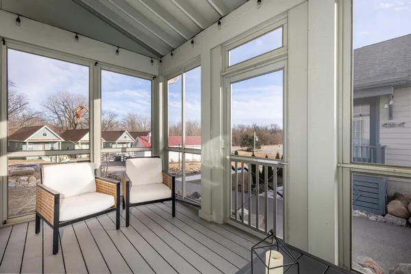 a kitchen with kitchen island a sink stainless steel appliances and cabinets