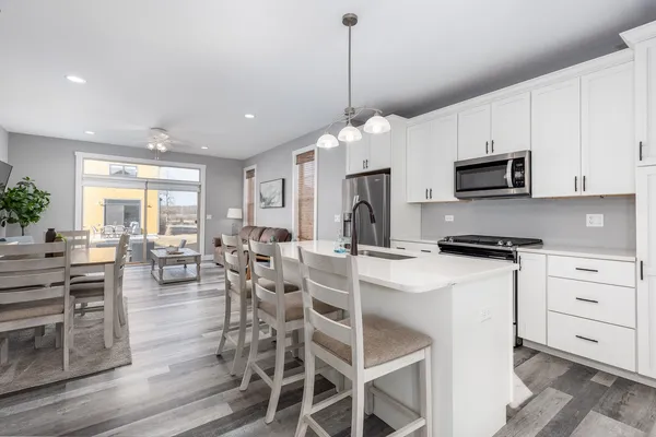 a view of a dining room with furniture and wooden floor