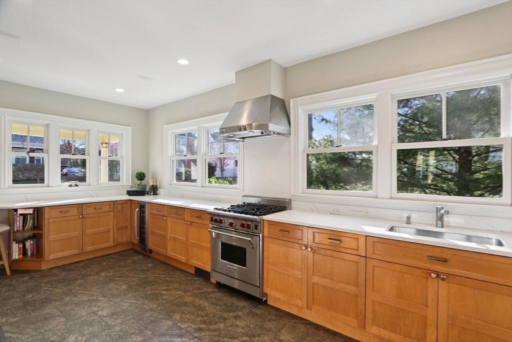 35 Frances Street Melrose, MA 02176 - Photo 13 of 42 a kitchen with stainless steel appliances granite countertop a stove and a sink