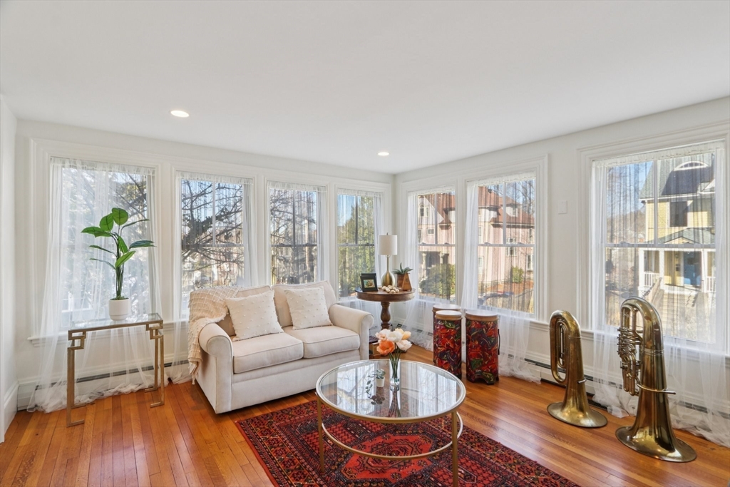 35 Frances Street Melrose, MA 02176 - Photo 8 of 42 a living room with furniture floor to ceiling window and wooden floor