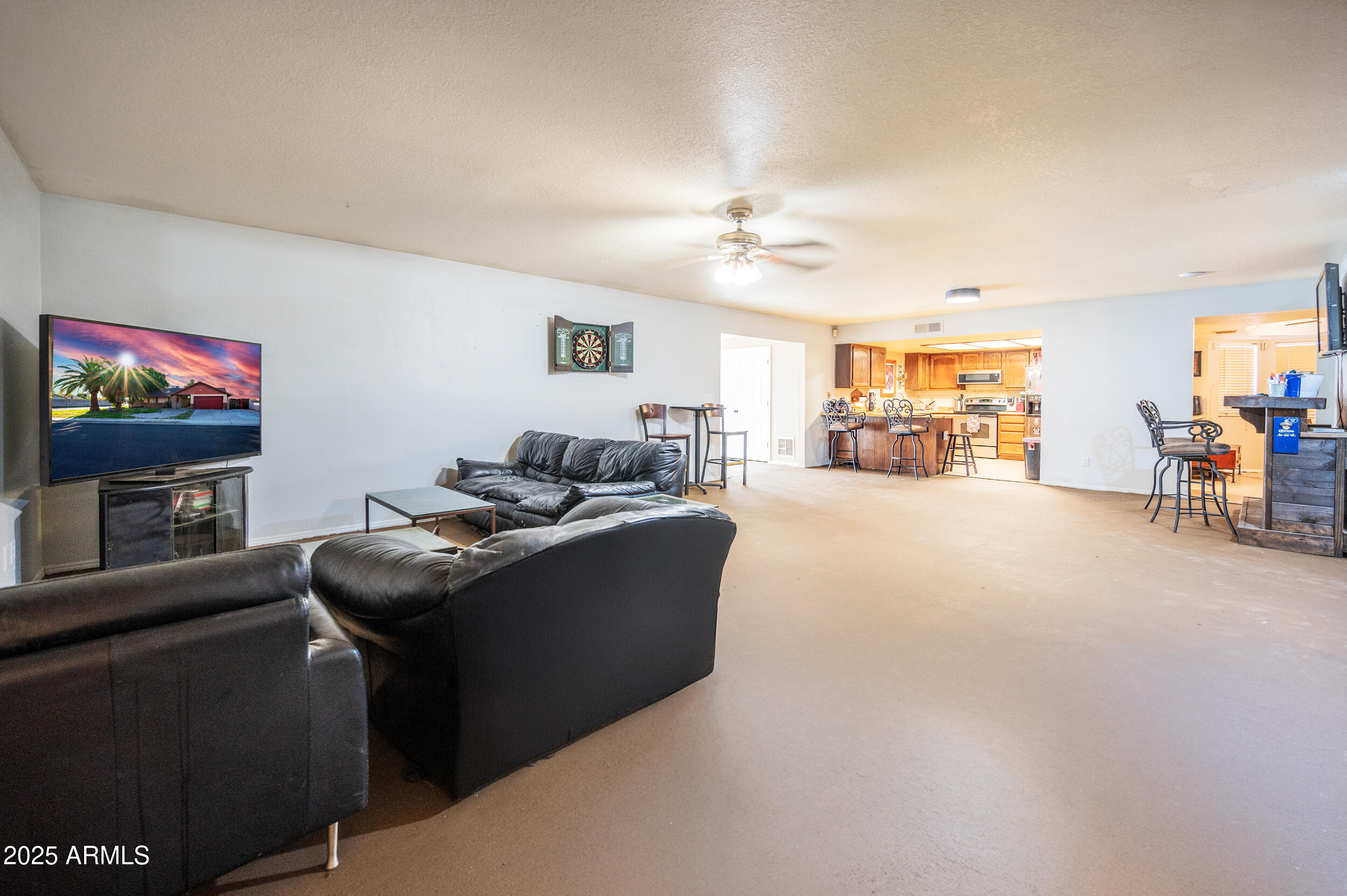 662 South Seton Mesa, AZ 85206 - Photo 11 of 25 a living room with furniture and a flat screen tv