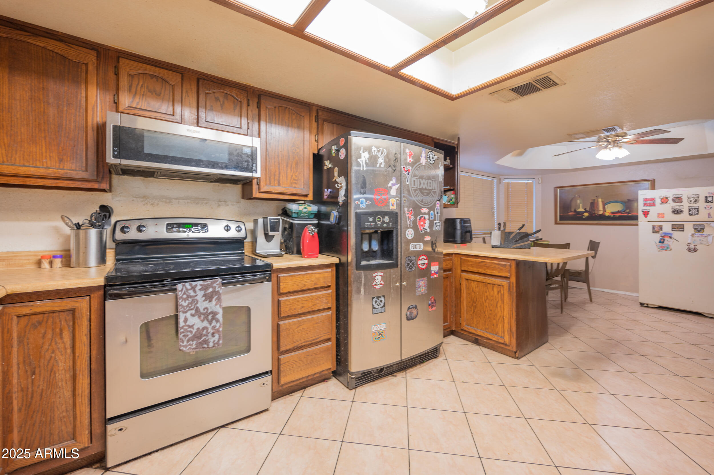 662 South Seton Mesa, AZ 85206 - Photo 14 of 25 a kitchen with cabinets and steel stainless steel appliances
