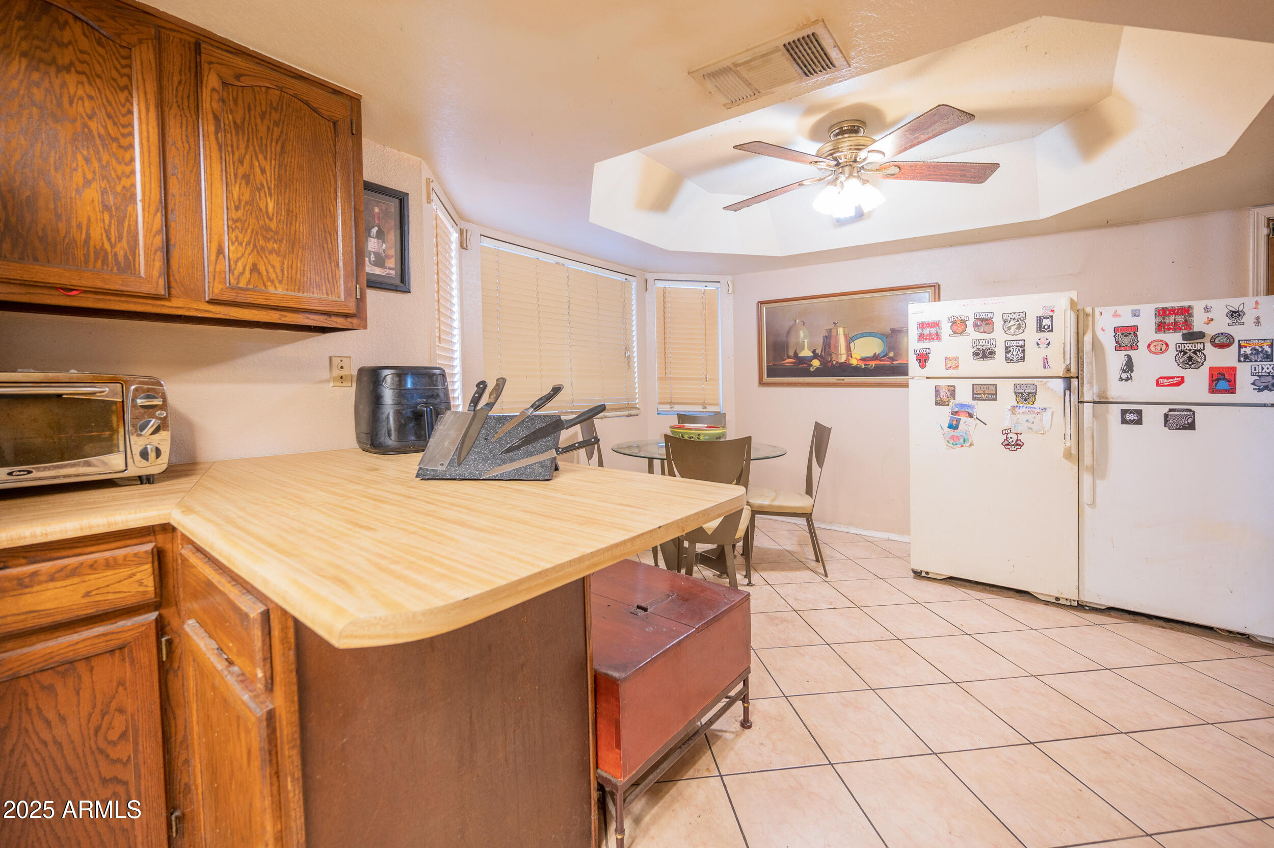 662 South Seton Mesa, AZ 85206 - Photo 15 of 25 a kitchen with stainless steel appliances a refrigerator and cabinets