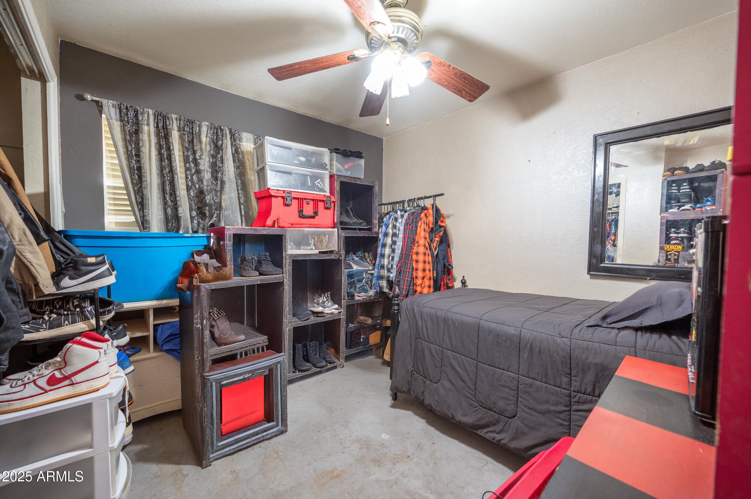662 South Seton Mesa, AZ 85206 - Photo 19 of 25 a bedroom with a bed and a flat tv screen on dresser