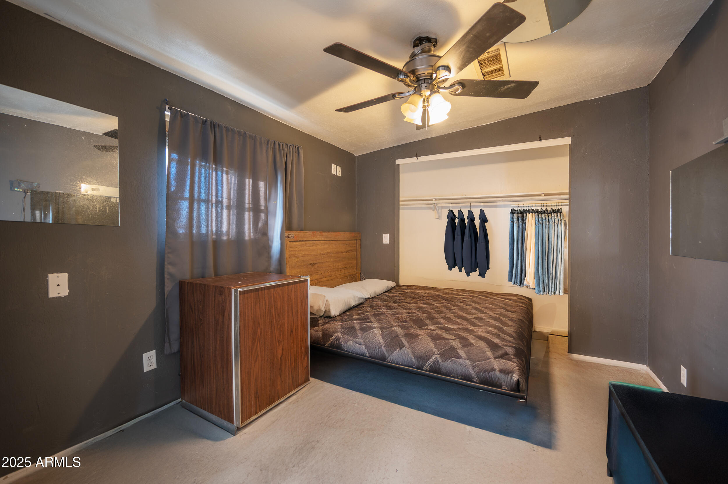 662 South Seton Mesa, AZ 85206 - Photo 22 of 25 a bedroom with a bed and a chandelier
