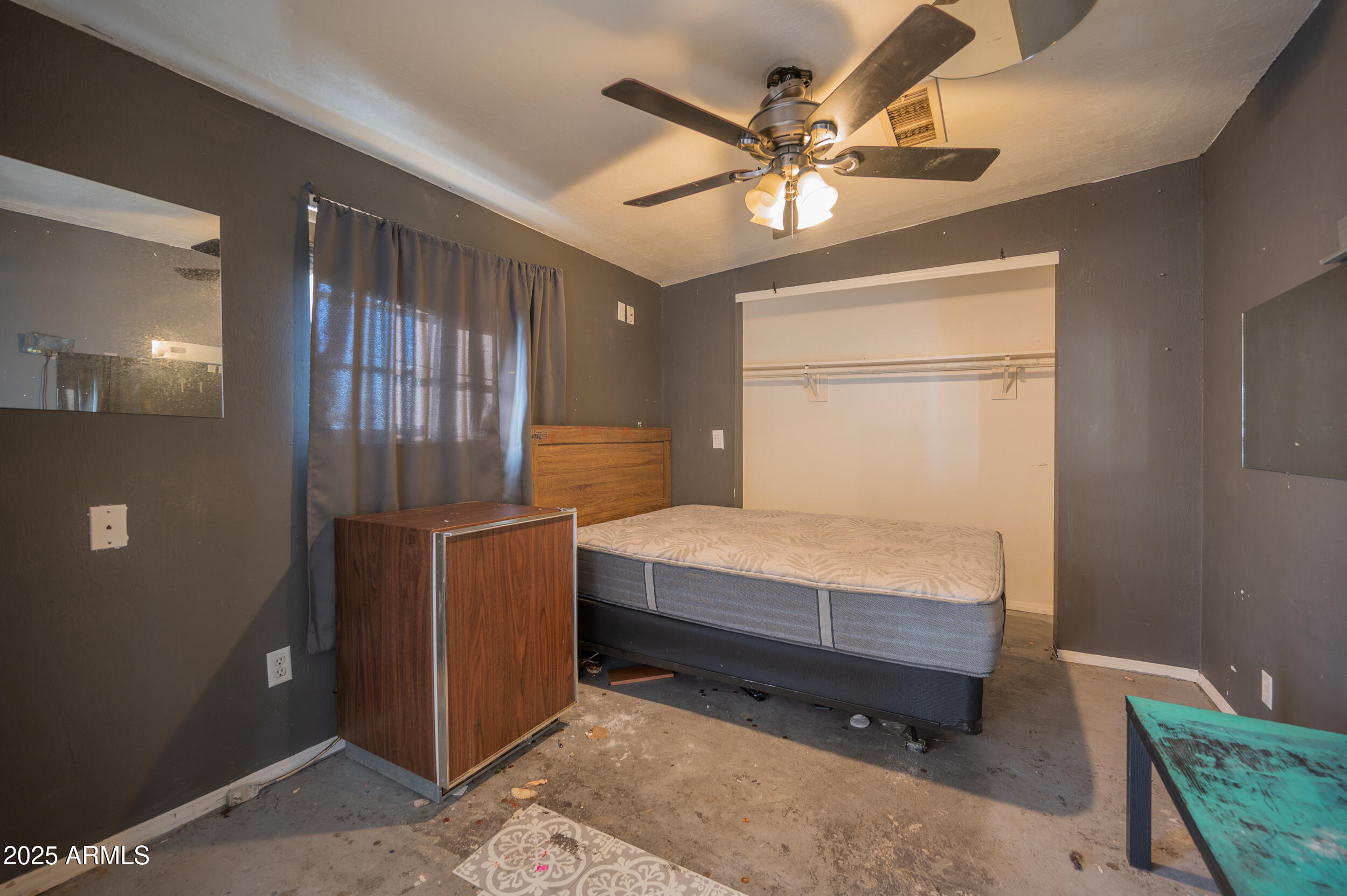 662 South Seton Mesa, AZ 85206 - Photo 23 of 25 a bedroom with a bed and a chandelier