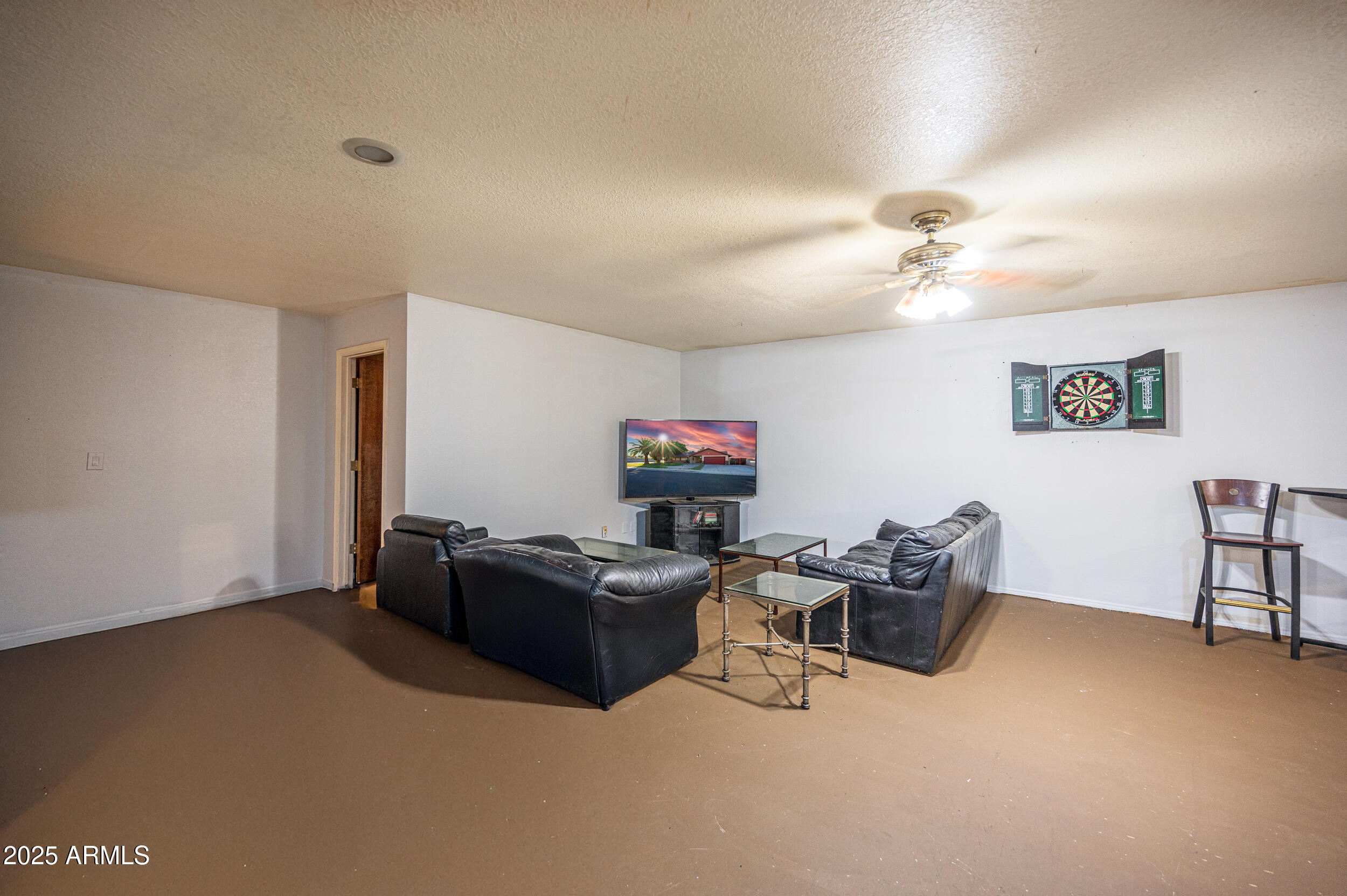 662 South Seton Mesa, AZ 85206 - Photo 7 of 25 a living room with furniture and a flat screen tv