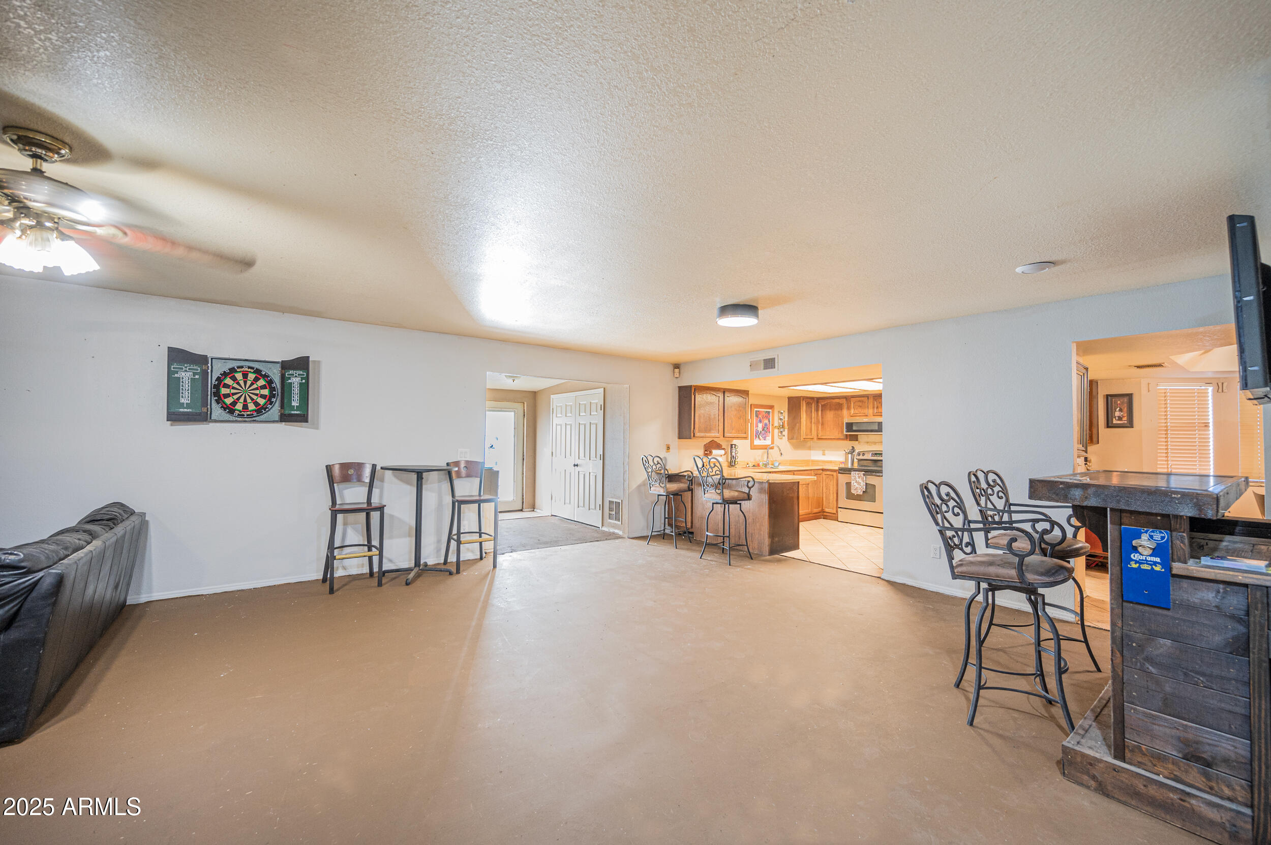 662 South Seton Mesa, AZ 85206 - Photo 8 of 25 a living room with furniture and a dining table with fireplace