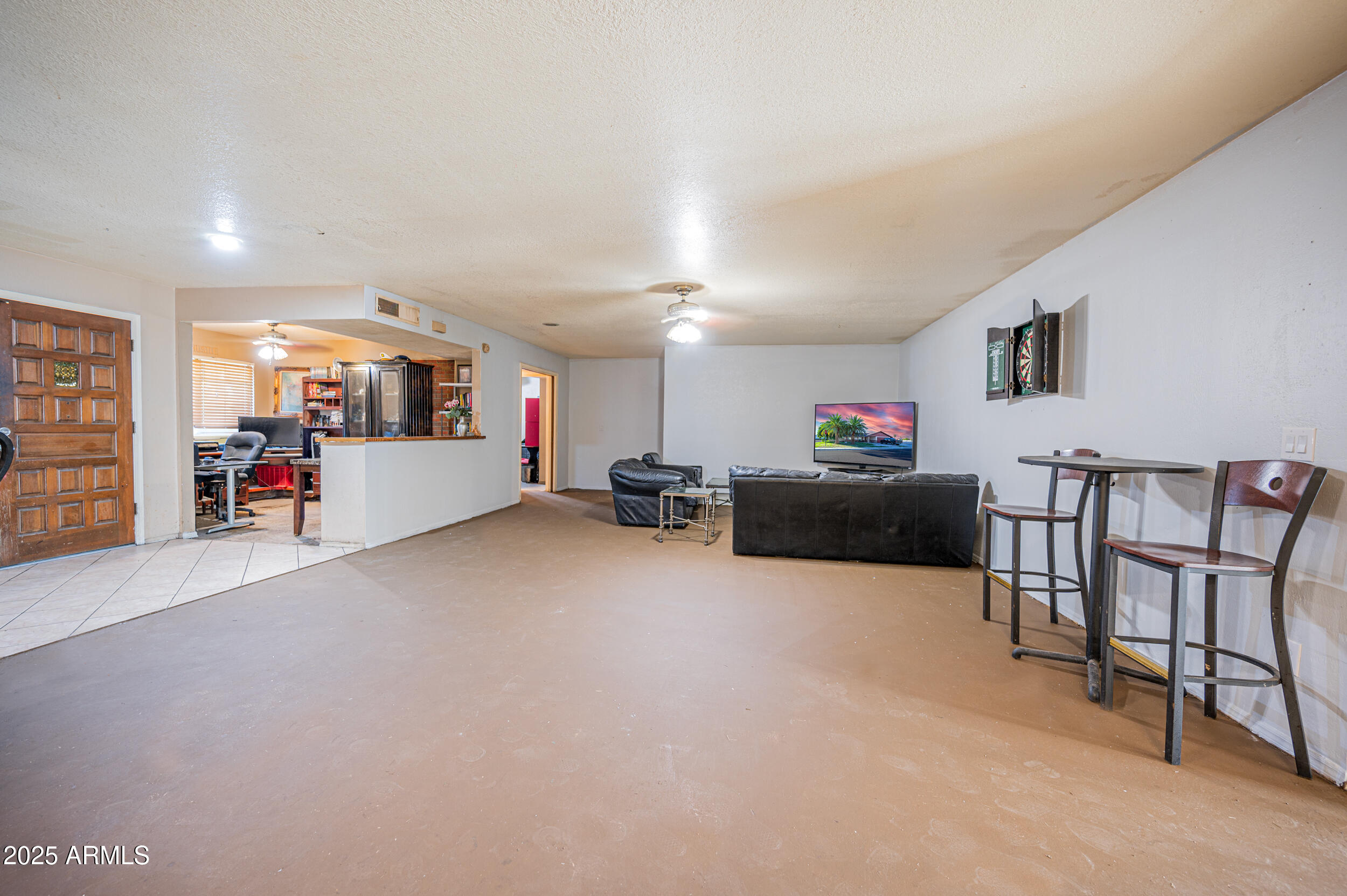 662 South Seton Mesa, AZ 85206 - Photo 9 of 25 a living room with furniture and a flat screen tv