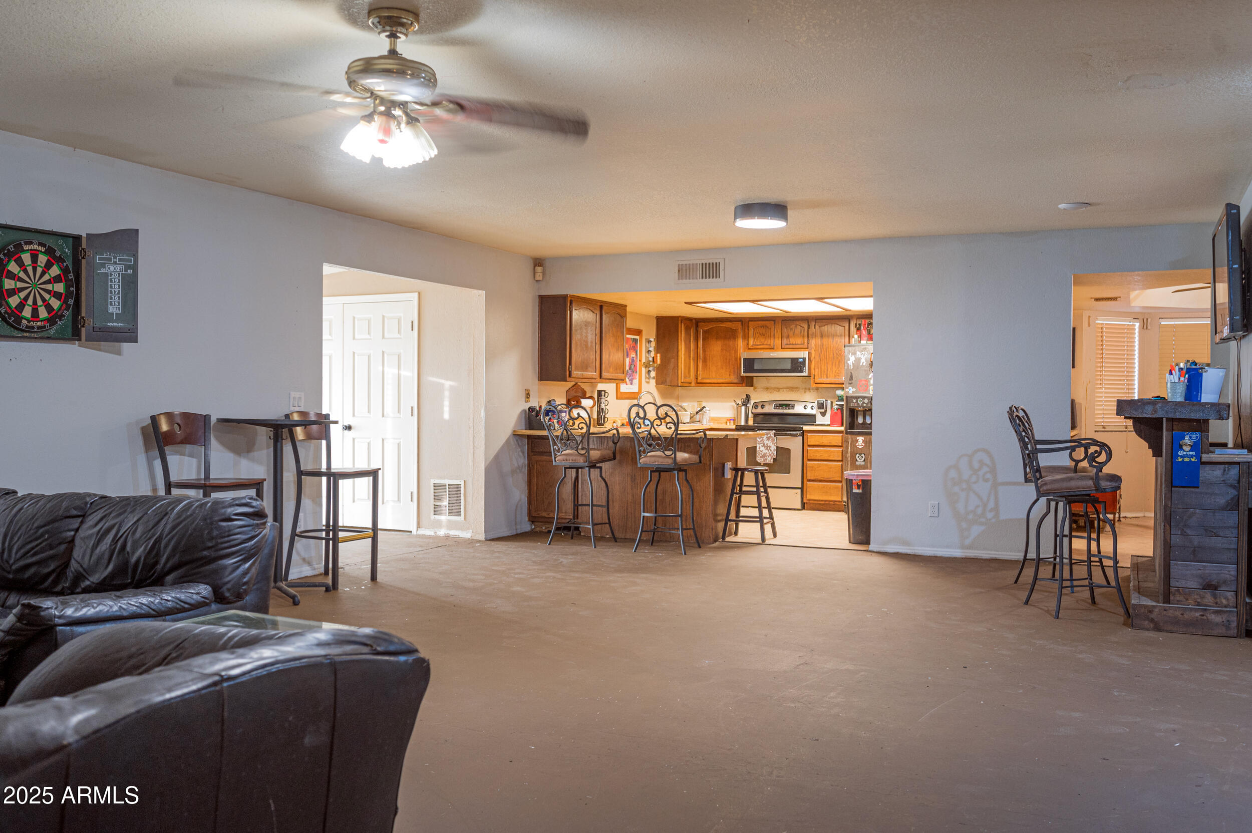 662 South Seton Mesa, AZ 85206 - Photo 10 of 25 a living room with furniture and a chandelier