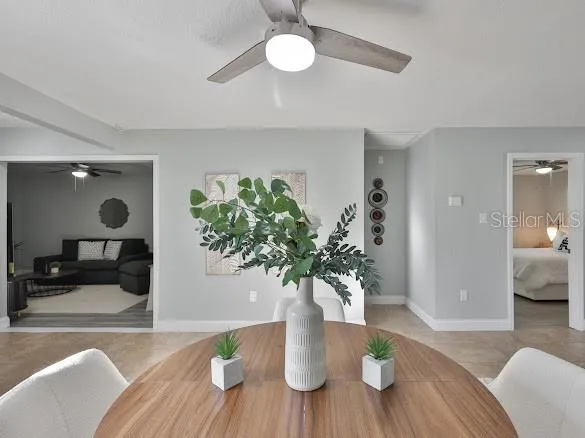 a dining room with furniture and window