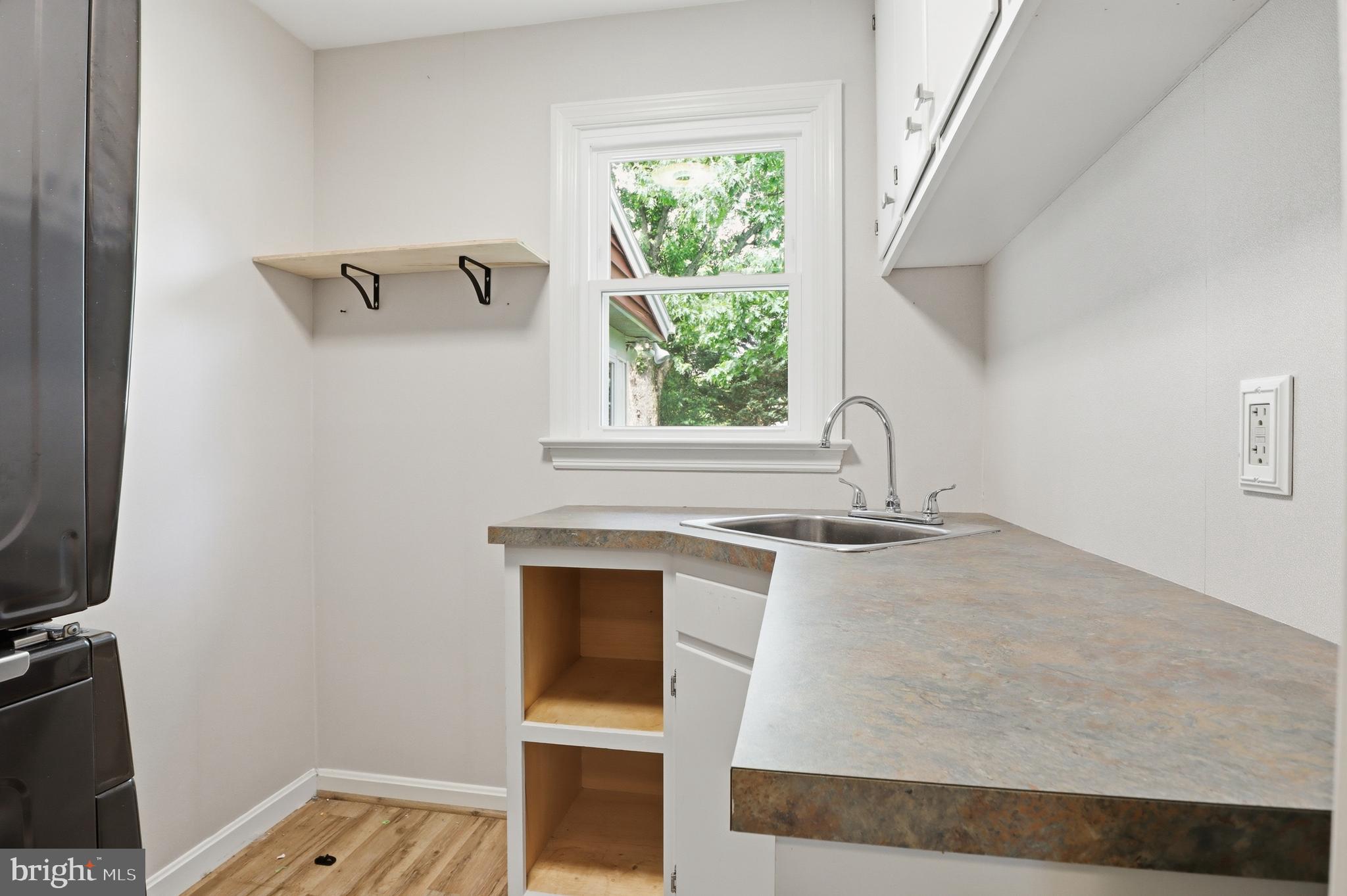 1072 Lambley Road Landisville, PA 17538 - Photo 40 of 46 a view of washer and dryer with kitchen in the background