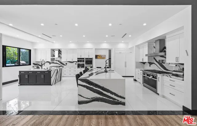 a bedroom with a bed and a flat tv screen on dresser