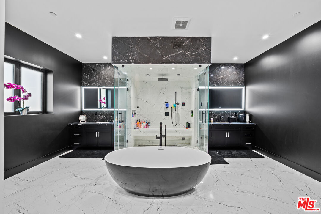 6006 Spring Valley Road Hidden Hills, CA 91302 - Photo 15 of 31 a living room with furniture and a flat screen tv