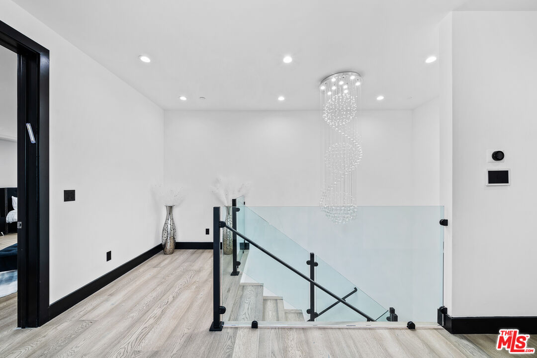 6006 Spring Valley Road Hidden Hills, CA 91302 - Photo 18 of 31 a view of entryway and hall with wooden floor