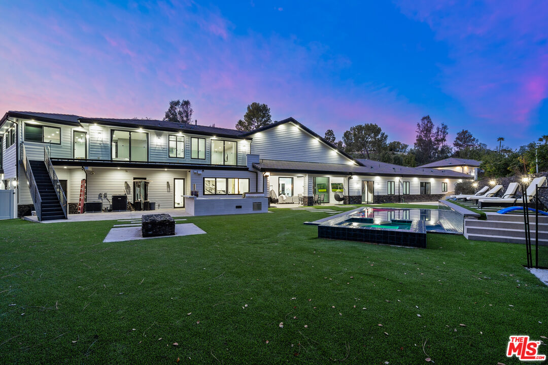 6006 Spring Valley Road Hidden Hills, CA 91302 - Photo 28 of 31 a view of an house with backyard space and dining area