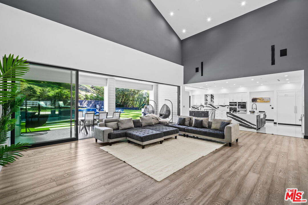 6006 Spring Valley Road Hidden Hills, CA 91302 - Photo 4 of 31 a living room with furniture and a large window