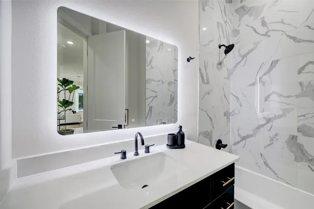 a view of a patio with table and chairs with wooden floor and fence