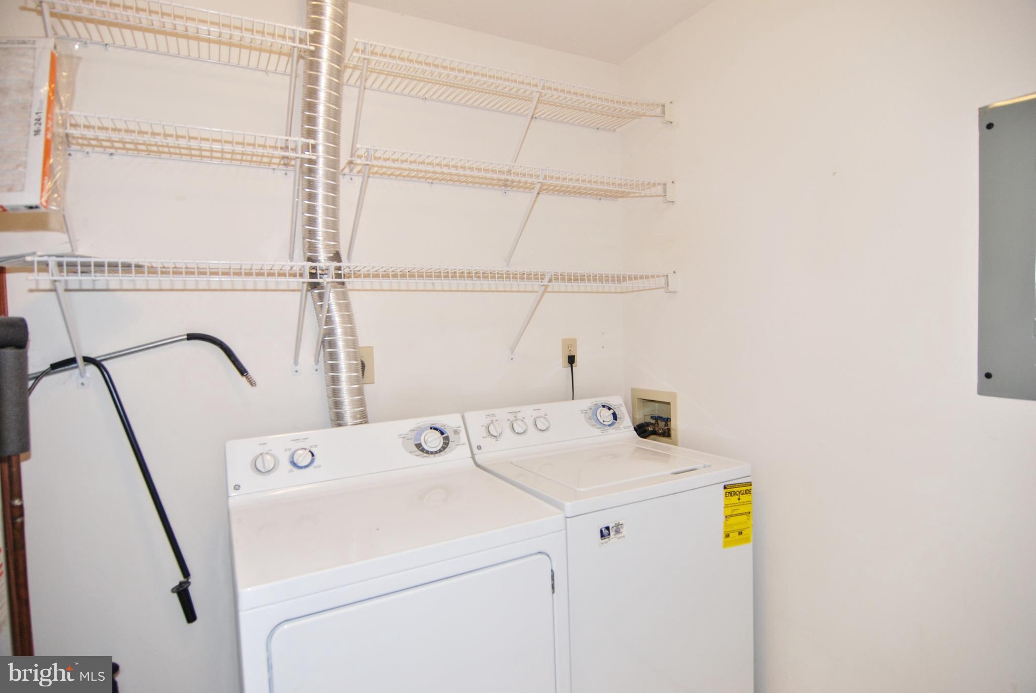 2402 Dominion Drive, Unit 2C Frederick, MD 21702 - Photo 13 of 34 The laundry rooms is large with extra storage.