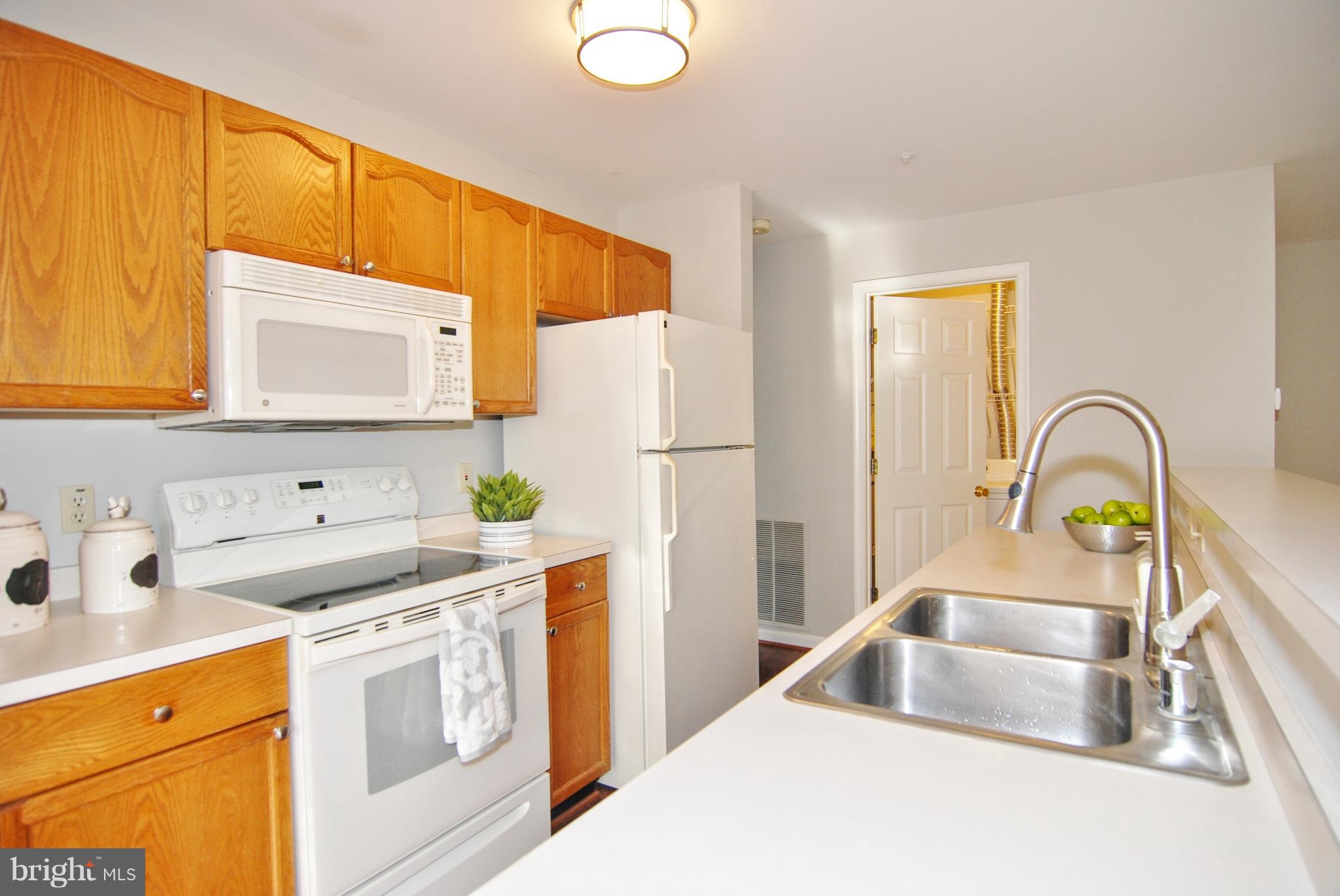 2402 Dominion Drive, Unit 2C Frederick, MD 21702 - Photo 9 of 34 fresh paint and neutral counters.