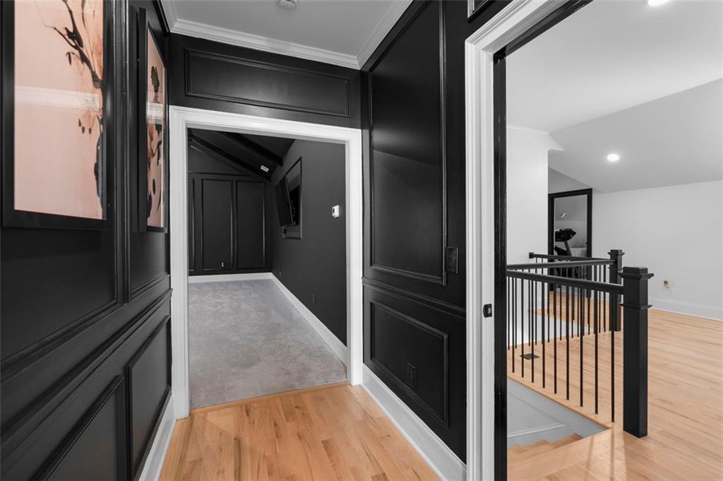 4097 Gilmore Road Southeast Smyrna, GA 30080 - Photo 12 of 26 a view of a hallway with wooden floor and staircase
