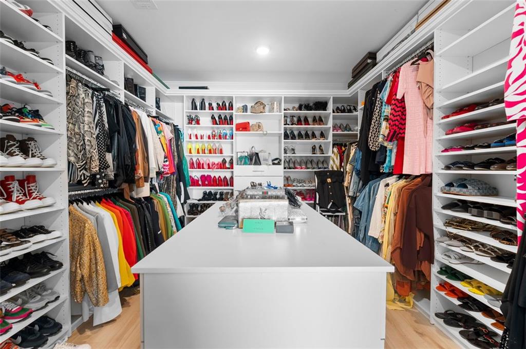 4097 Gilmore Road Southeast Smyrna, GA 30080 - Photo 15 of 26 a view of walk in closet with clothes and shoes