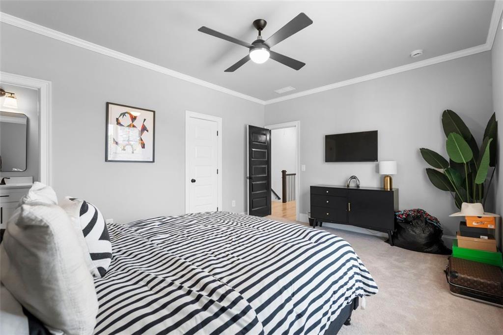 4097 Gilmore Road Southeast Smyrna, GA 30080 - Photo 20 of 26 a bedroom with a bed and a flat screen tv