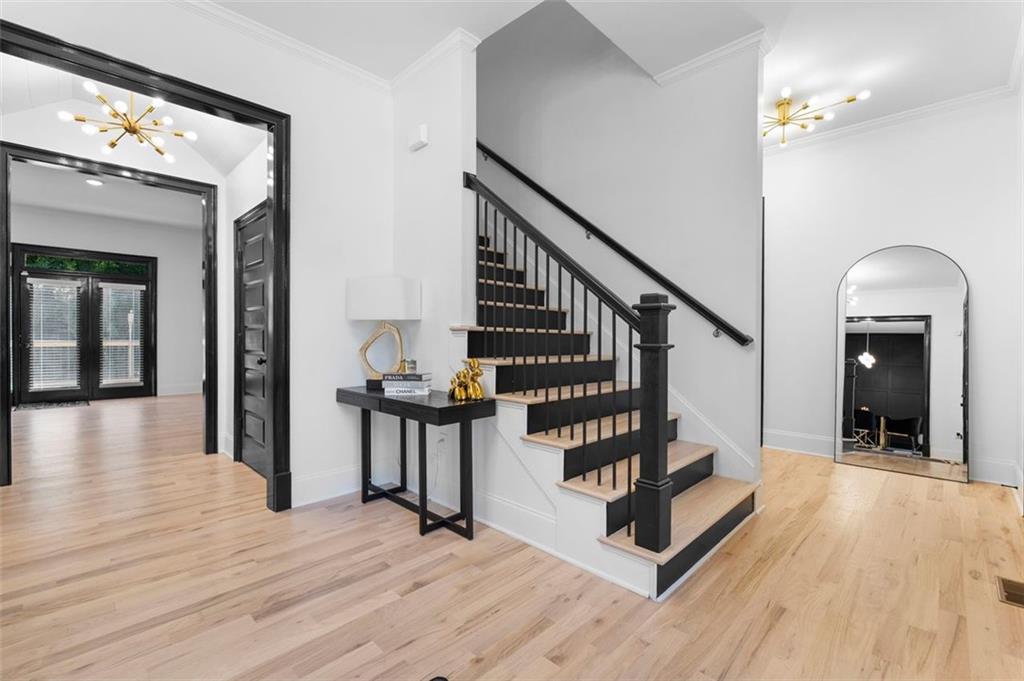 4097 Gilmore Road Southeast Smyrna, GA 30080 - Photo 3 of 26 a view of a hallway with wooden floor and staircase
