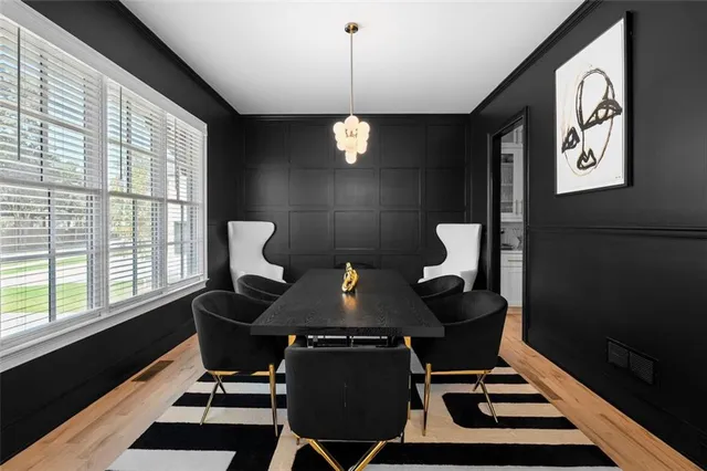 a kitchen with stainless steel appliances granite countertop a stove a refrigerator a oven a sink with island and chairs