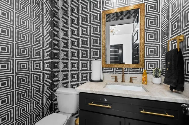 a bathroom with a bathtub sink and a mirror