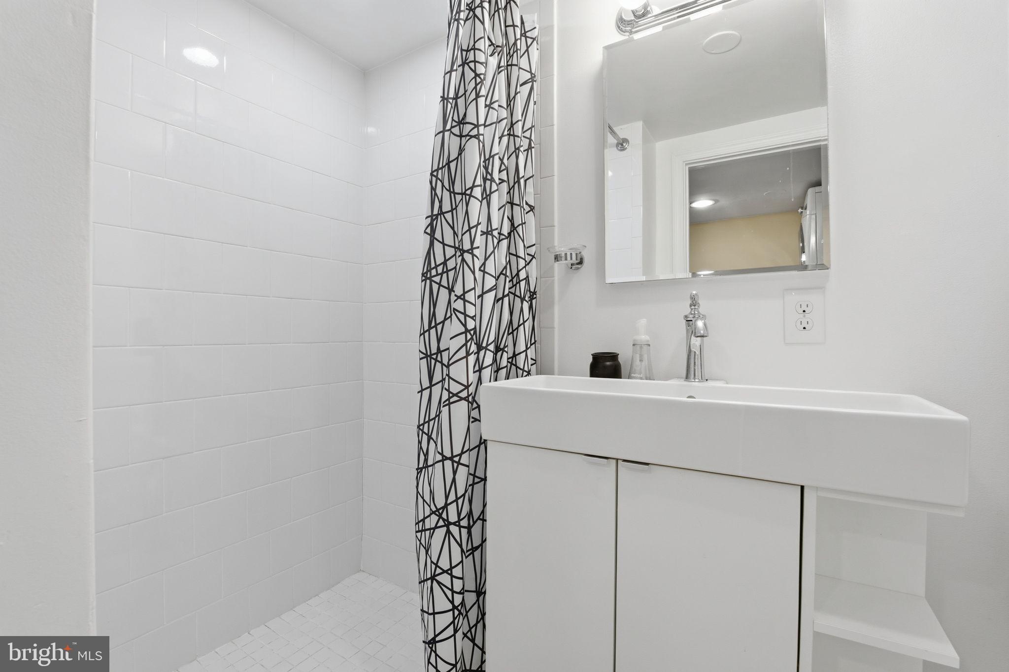 7809 Boston Avenue Silver Spring, MD 20910 - Photo 20 of 25 Sleek, modern bathroom oasis.