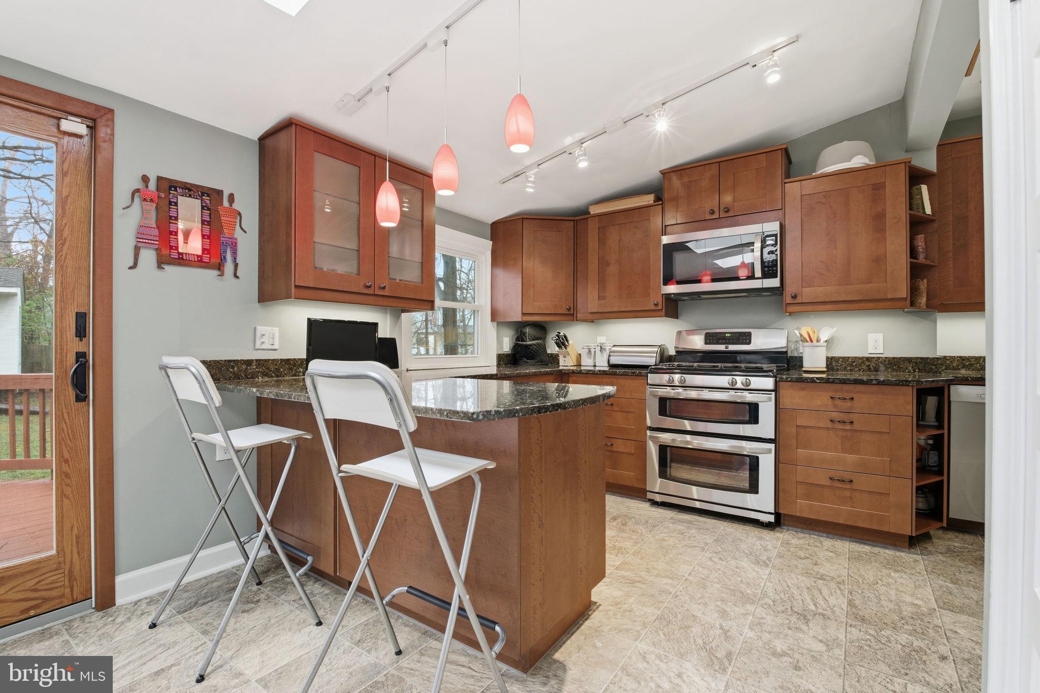 7809 Boston Avenue Silver Spring, MD 20910 - Photo 7 of 25 Modern kitchen with warm wood tones.