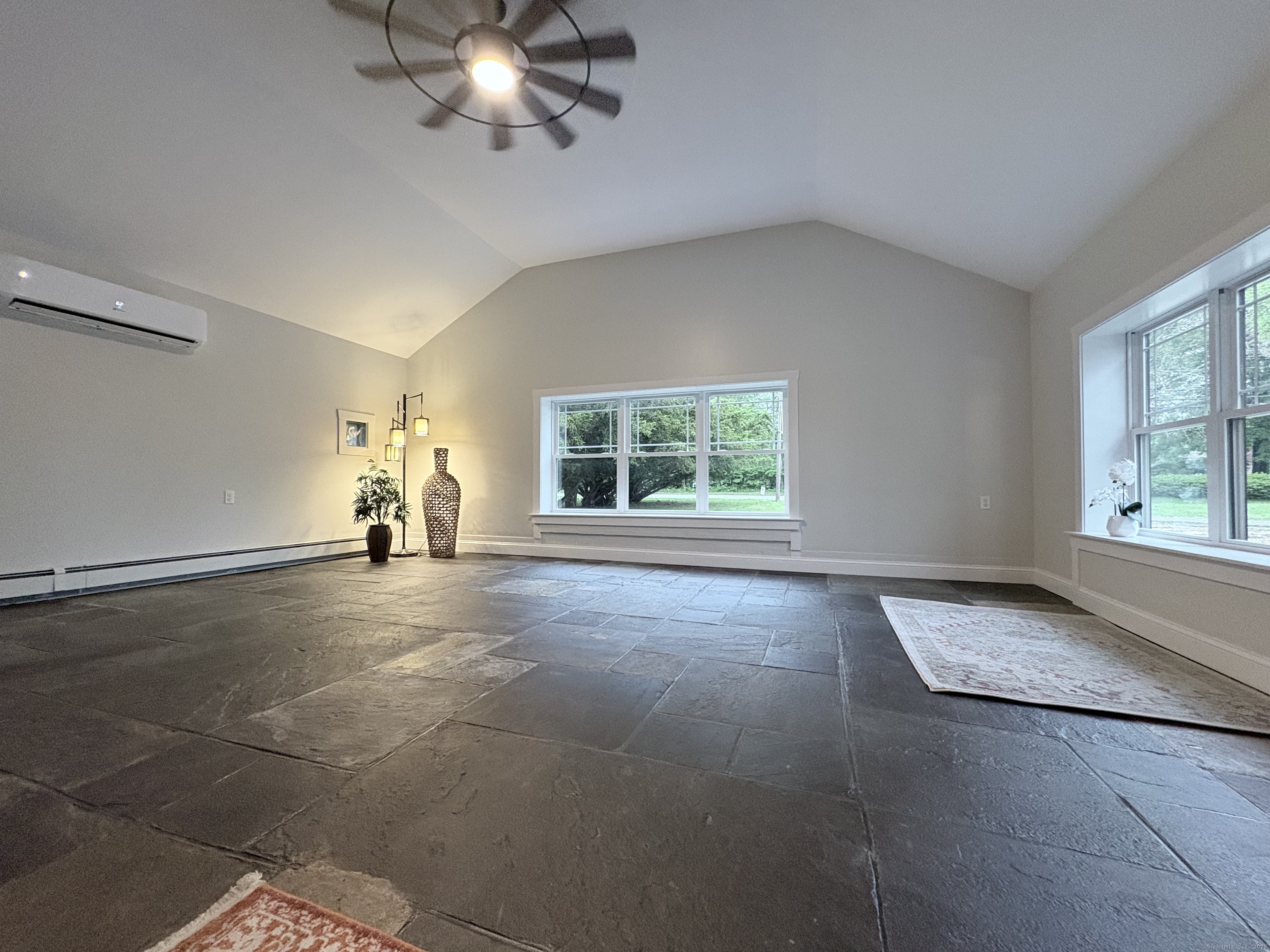 220 West Road Colchester, CT 06415 - Photo 18 of 40 Great Room has slate flooring and Mini Split for cool comfort in Summer