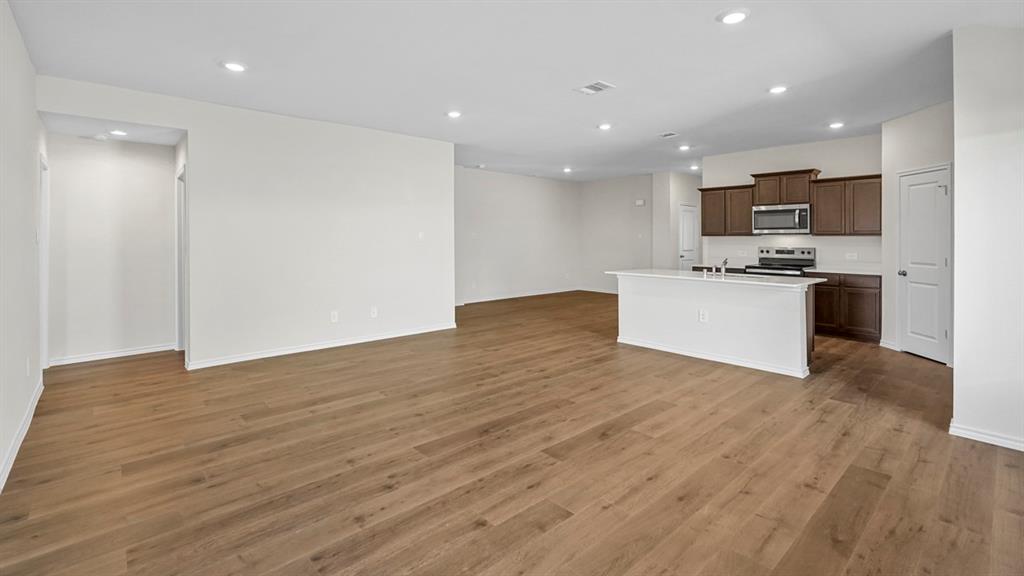 1953 Freeman Street Tyler, TX 75704 - Photo 10 of 32 Open-concept living space with wood-finish flooring