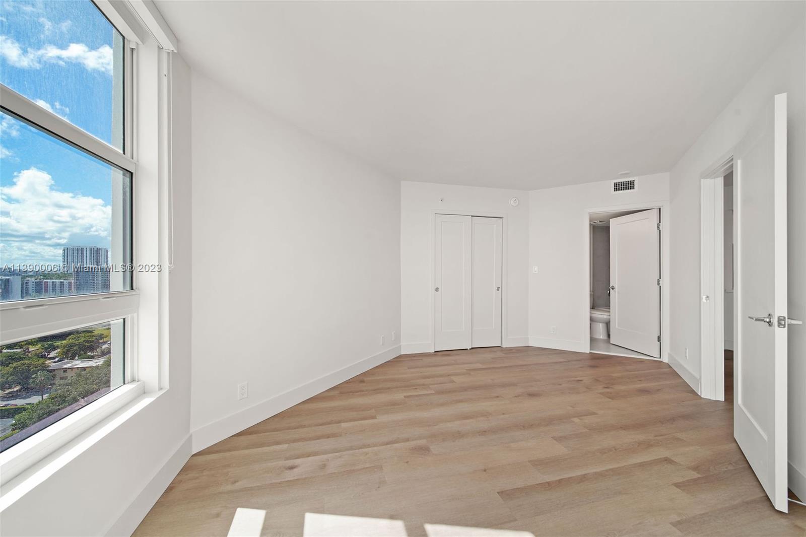 555 Northeast 34th Street, Unit 2307 Miami, FL 33137 - Photo 19 of 63 a view of an empty room and window