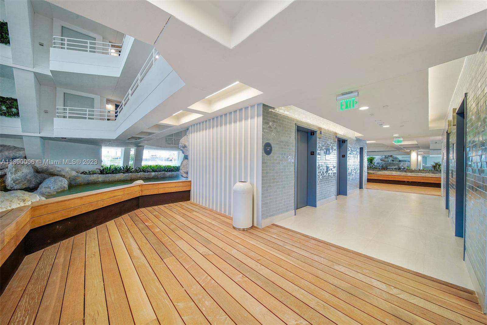 555 Northeast 34th Street, Unit 2307 Miami, FL 33137 - Photo 41 of 63 a view of hallway with a large window and wooden floor