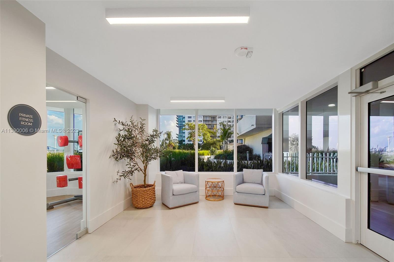 555 Northeast 34th Street, Unit 2307 Miami, FL 33137 - Photo 42 of 63 a living room with furniture and a large window