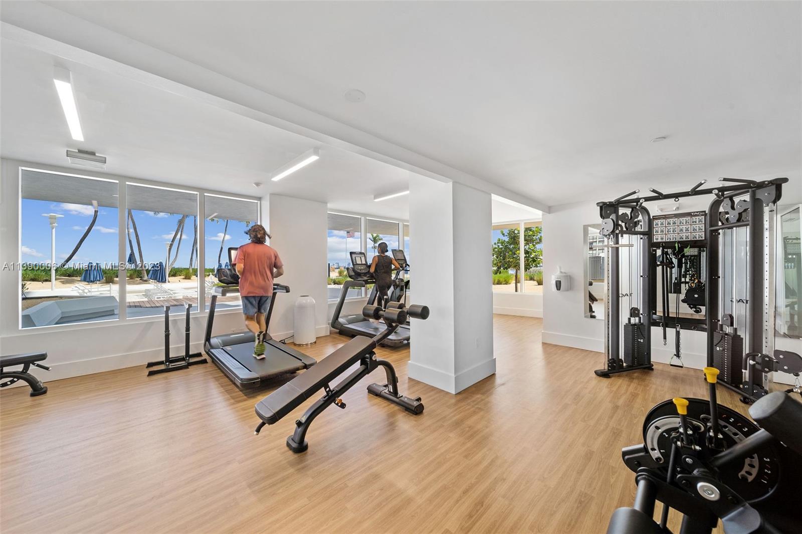 555 Northeast 34th Street, Unit 2307 Miami, FL 33137 - Photo 47 of 63 a view of a room with gym equipment
