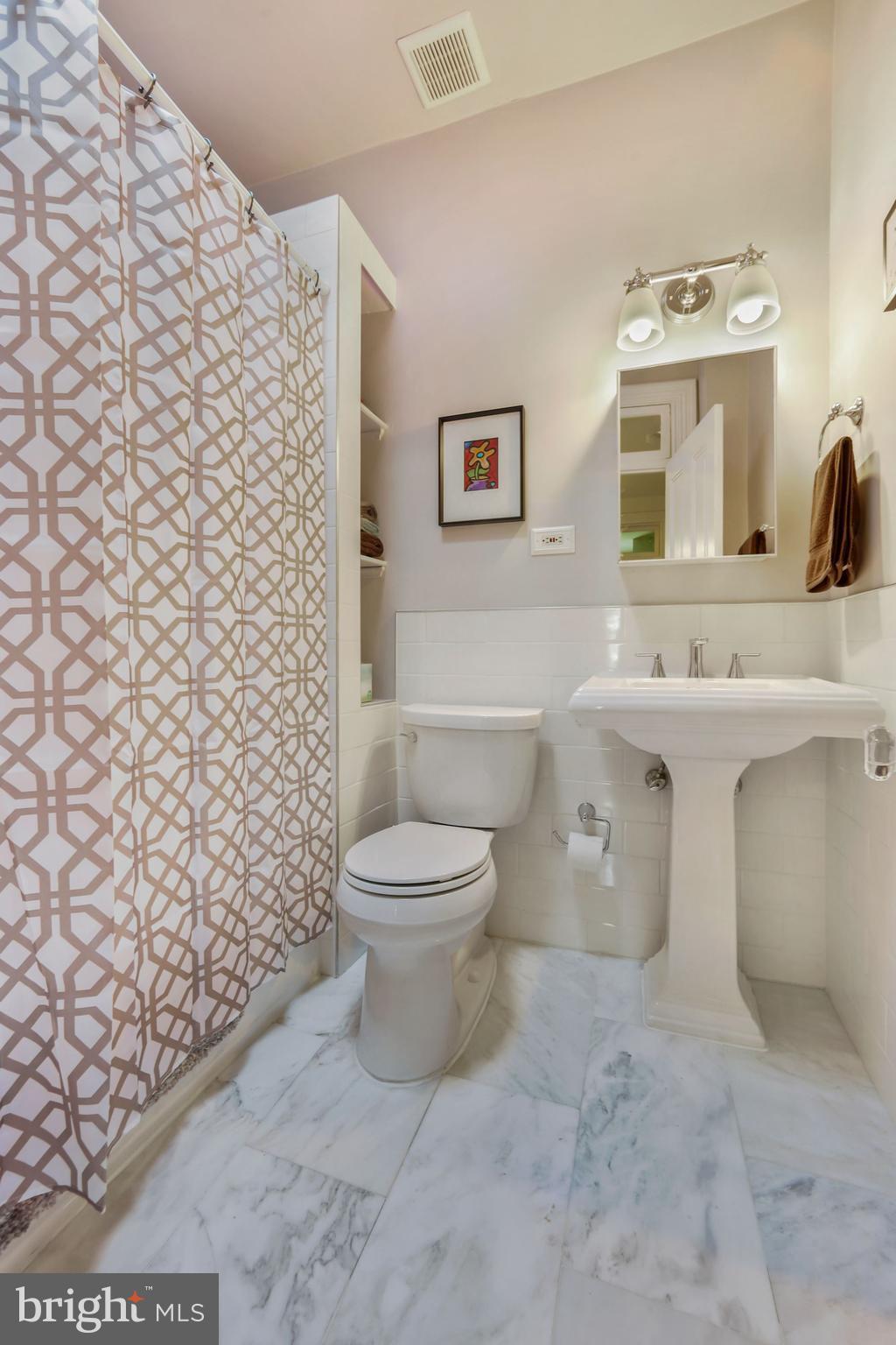 942 O Street Northwest Washington, DC 20001 - Photo 12 of 28 Updated upper level bathroom