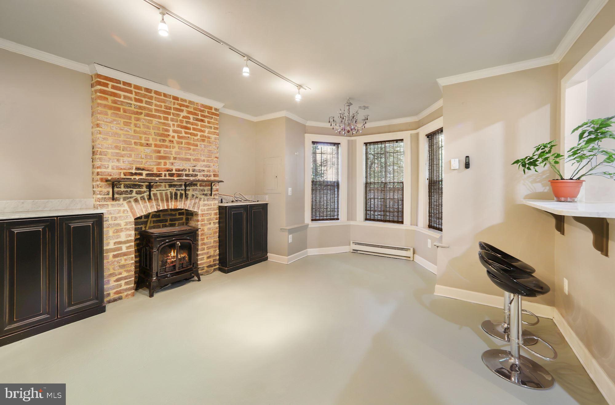 942 O Street Northwest Washington, DC 20001 - Photo 15 of 28 Vintage gas fireplace warms the room