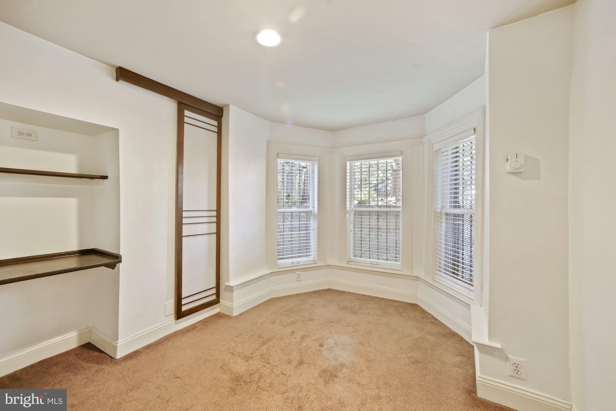 942 O Street Northwest Washington, DC 20001 - Photo 18 of 28 Cozy bedroom offers natural light and storage