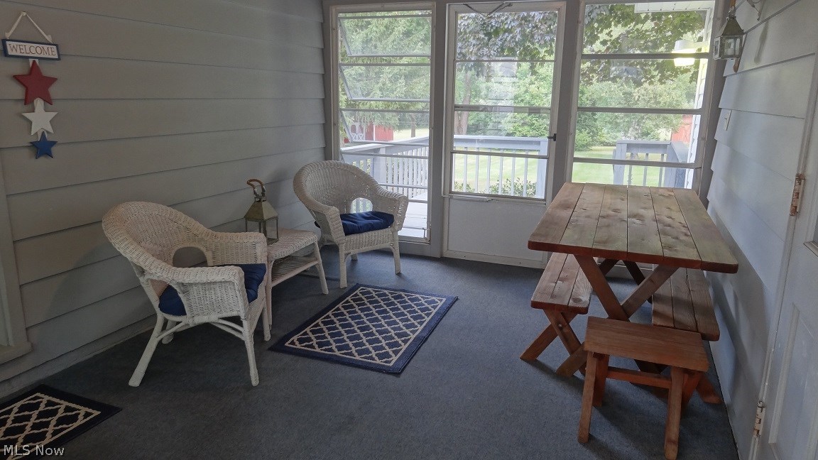 1765 Krumroy Road Akron, OH 44312 - Photo 21 of 24 This breezeway could get no better. You have access from the large 2plus car garage, the deck, and from the driveway and patio in the front. Gorgeous views of the front and backyard TOO.. WOW