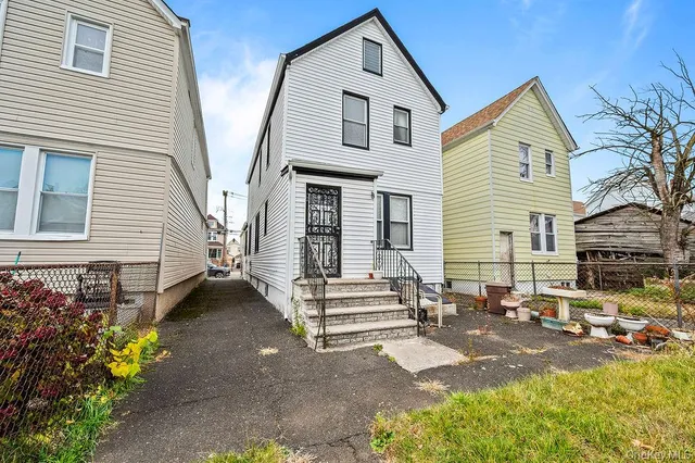 a view of walk in closet with clothes