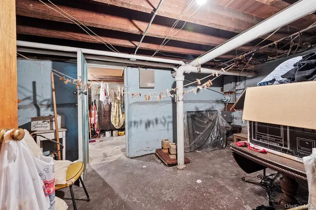 a living room filled with furniture and a mirror