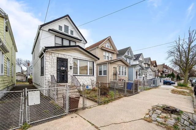 a front view of a house with garage