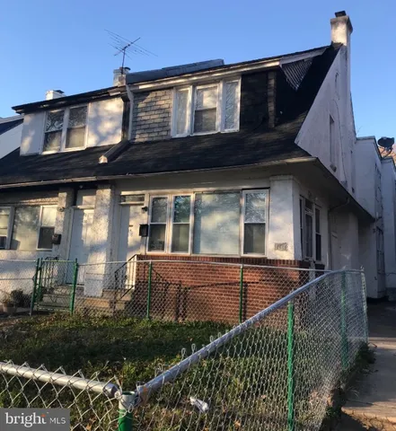 a view of a house with a small yard